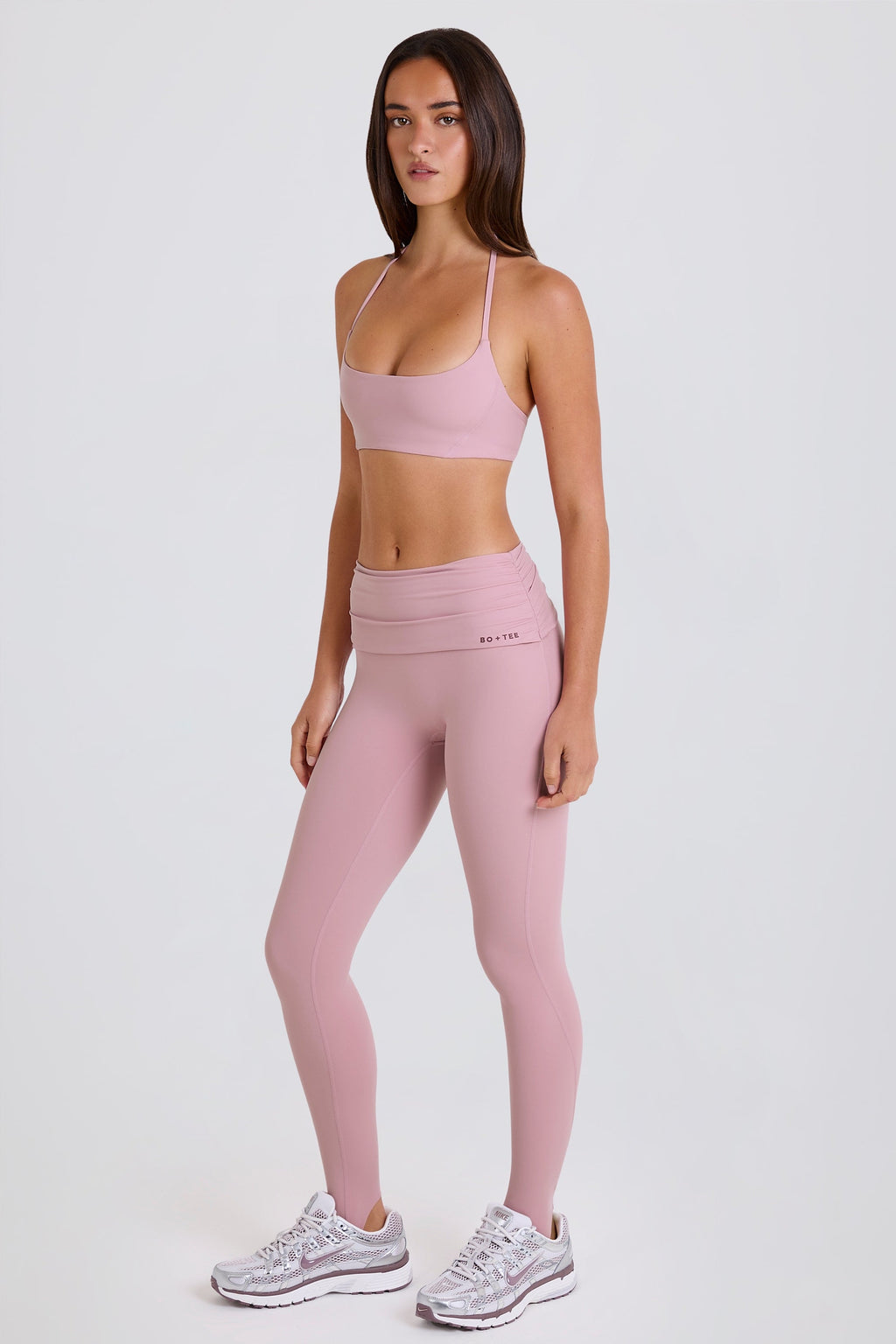 Four-Way Stretch Foldover Mid-Rise Stirrup Leggings in Mauve