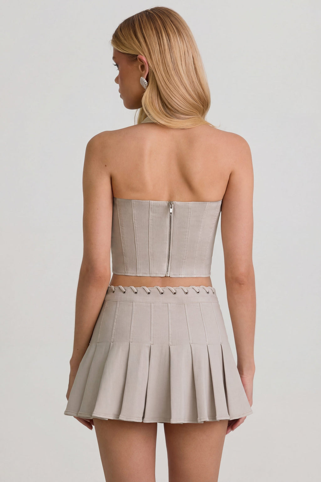 Low-Rise Pleated Mini Skirt in Ecru